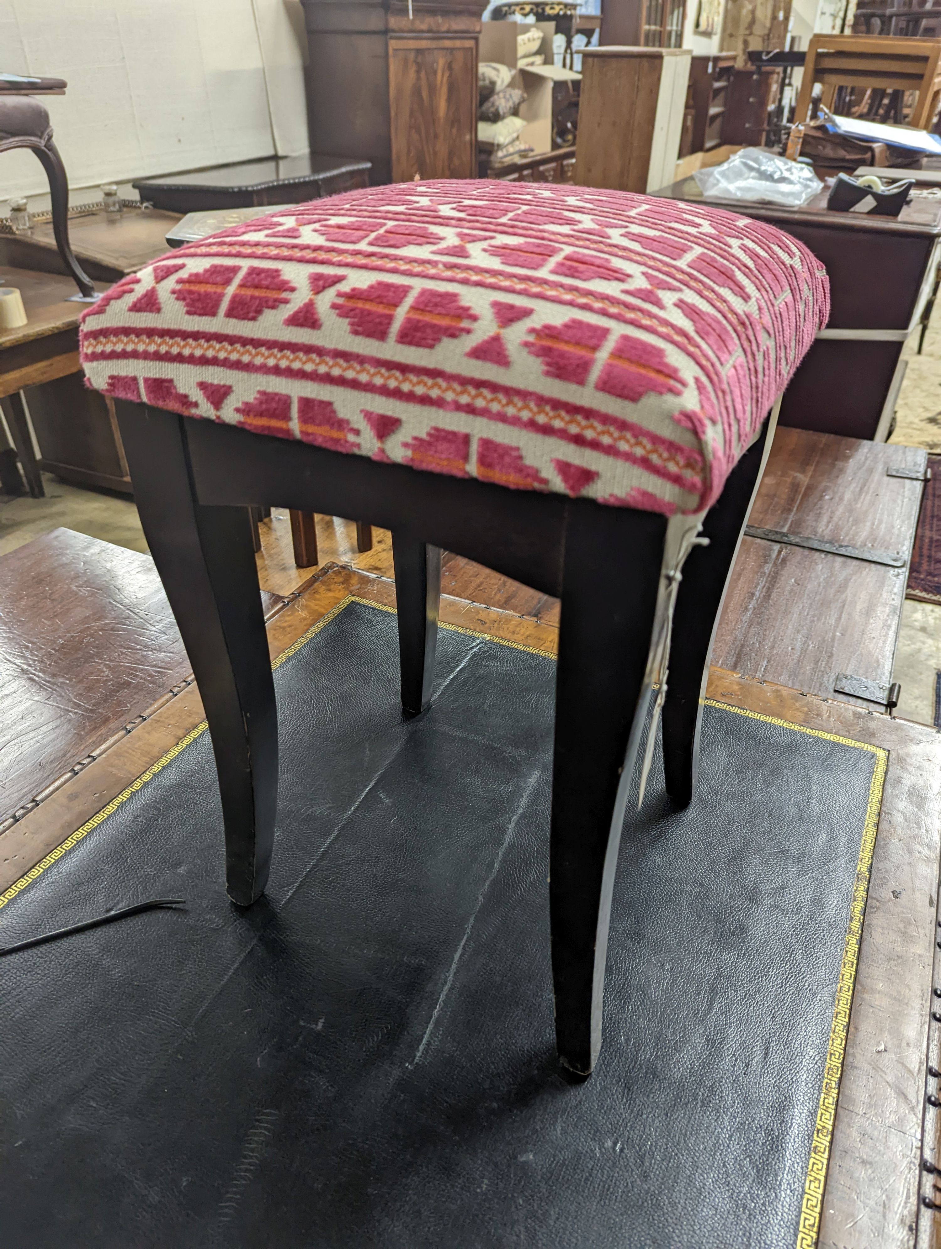 A square ebonised footstool upholstered in Andrew Martin fabric, width 32cm, height 50cm